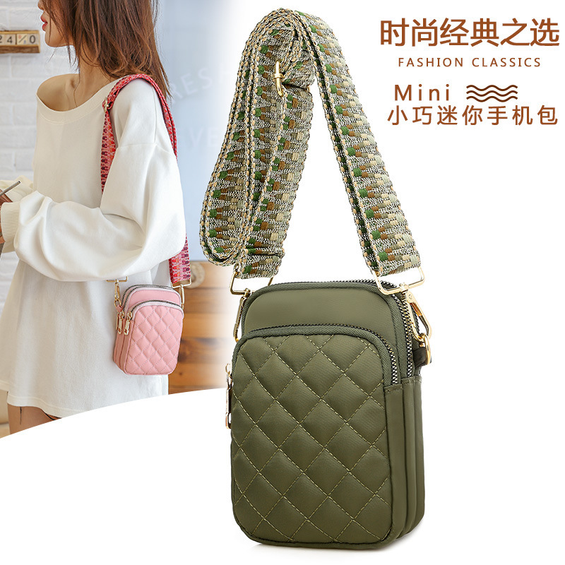 New embroidery cell phone for a lady with one-shoulder-slashed twirl bag and a waterproof nylon bag.