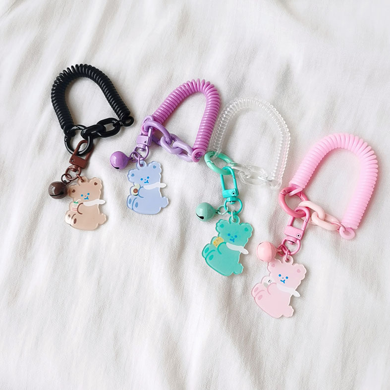 Con gấu bán thân nóng bỏng, dễ thương, vớ vẩn có thể kéo dài các nút dây điện thoại bằng nhựa mùa xuân.