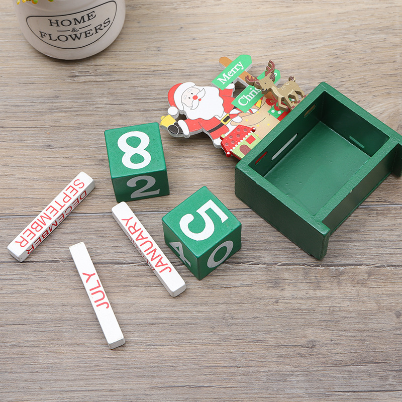 A Christmas tree with a digital calendar, an creative wood office table with children's Christmas presents