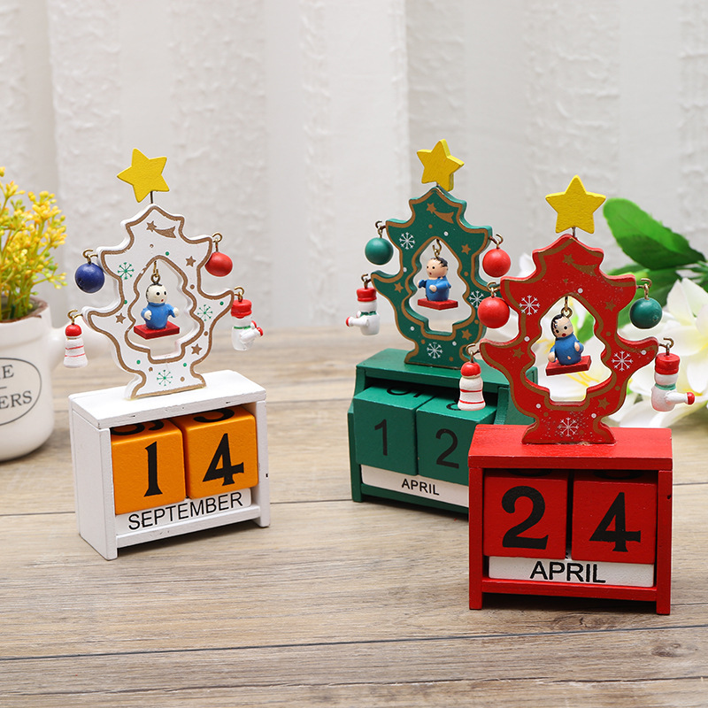 A Christmas tree with a digital calendar, an creative wood office table with children's Christmas presents