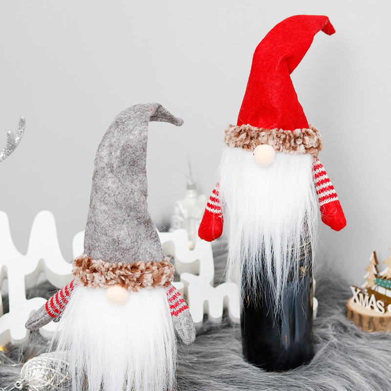 Christmas decorations, faceless red wine bottles, Santa's wine bag party costume.