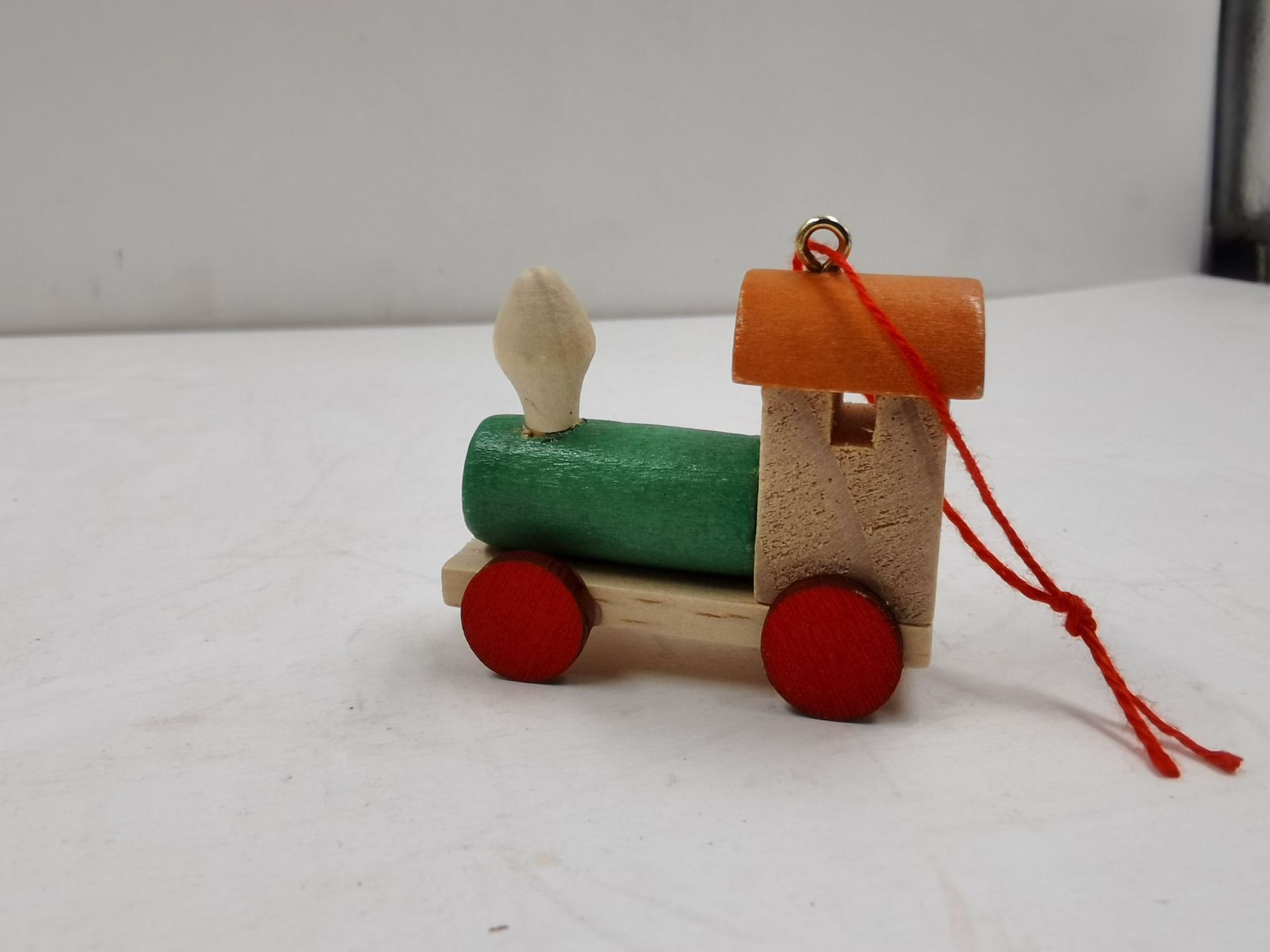 A new Christmas decoration little train holiday gift for a child on a wooden train.