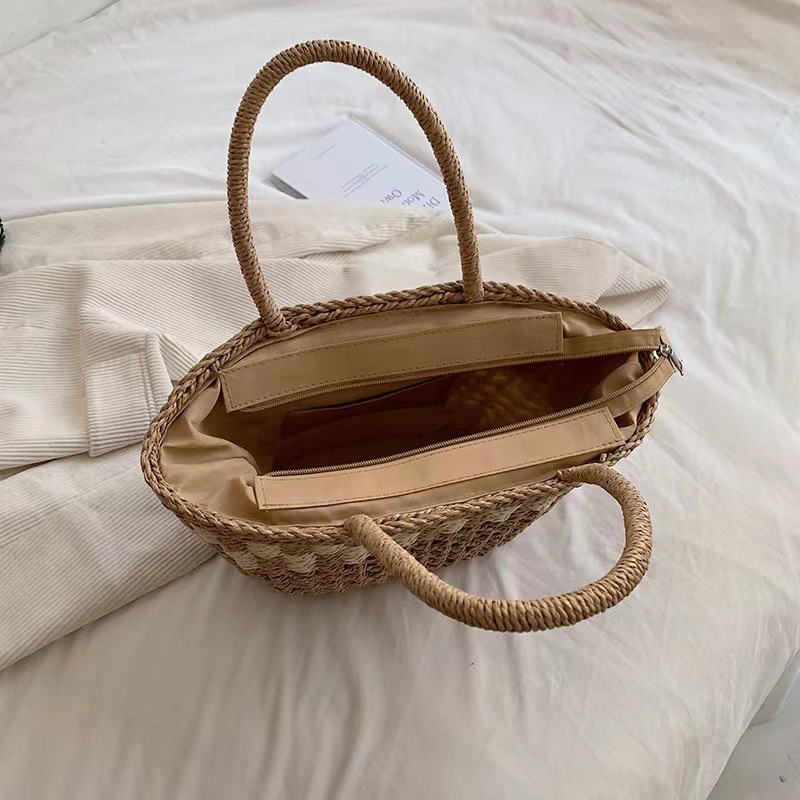 The factory supplies a single-shouldered, empty-weaving bag, a new large French-capacity, beach bun on the beach.