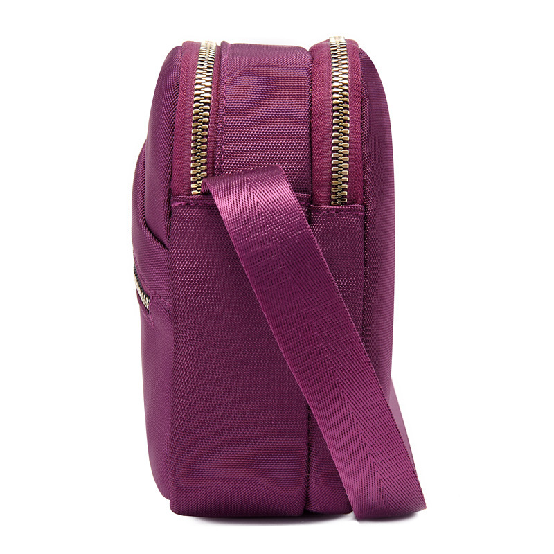 Summer nylon key cell phone bag with girl slant across the canvas.
