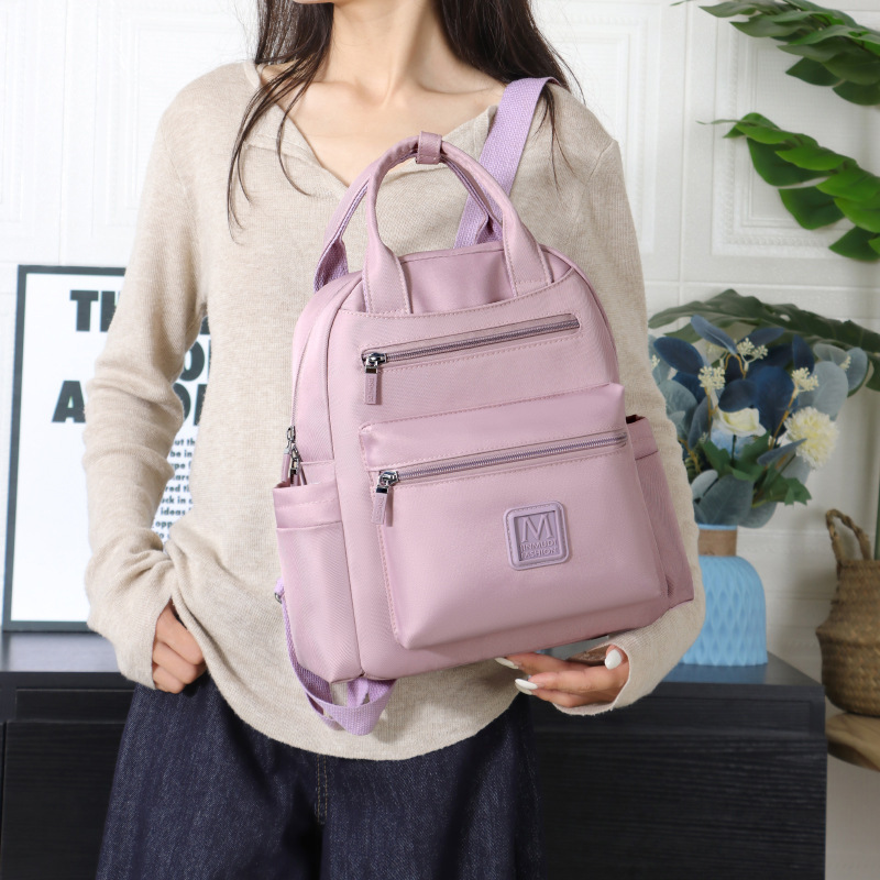 Two-shoulder-packed women with a full-time, hip-hop girl with a clean-coloured college school bag.