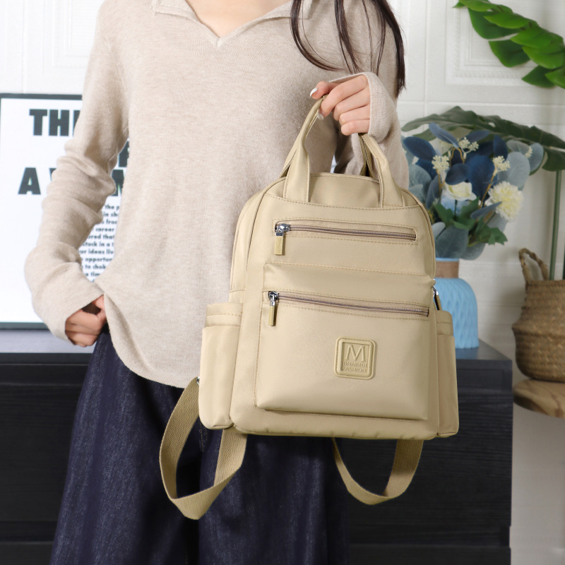 Two-shoulder-packed women with a full-time, hip-hop girl with a clean-coloured college school bag.
