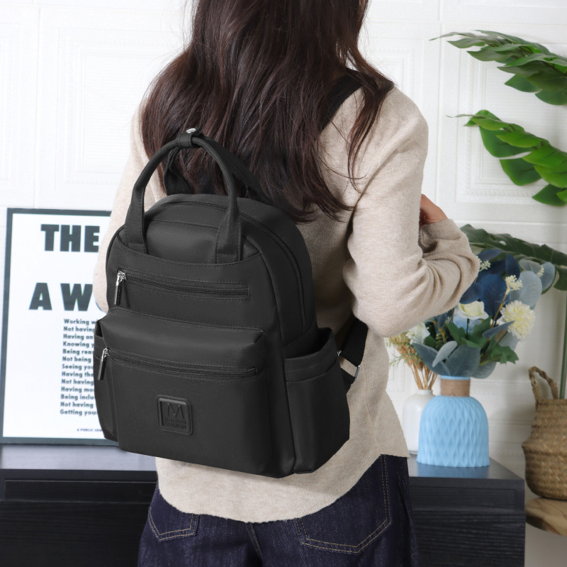 Two-shoulder-packed women with a full-time, hip-hop girl with a clean-coloured college school bag.