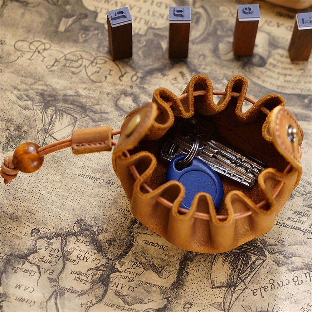 A man and woman's leather wallet is collected from the hands-on head of the oxen.