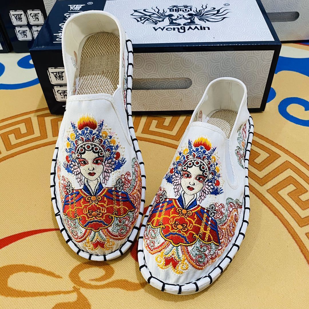 Old Beijing embroidered shoe-slippers with their shoes flattened to the bottom of a fisherman's shoe.