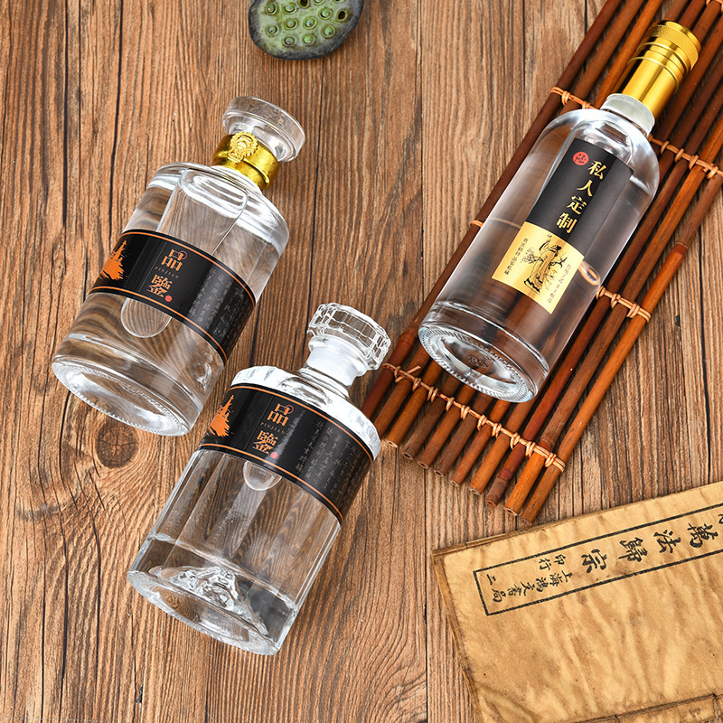 A new white bottle of 500 milligrams of white glass with an empty bottle of high-quality, transparent and self-made wine.