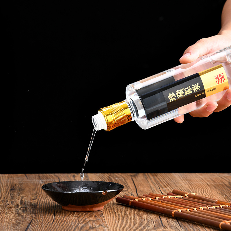 A new white bottle of 500 milligrams of white glass with an empty bottle of high-quality, transparent and self-made wine.