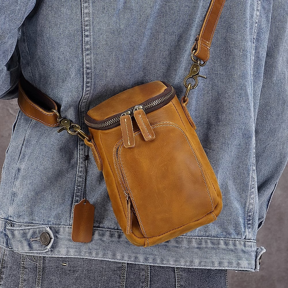 A retro-skin squint pack of mini-boys' heads, ox-skin cell phones with belts on their belts, and a recreational bag.