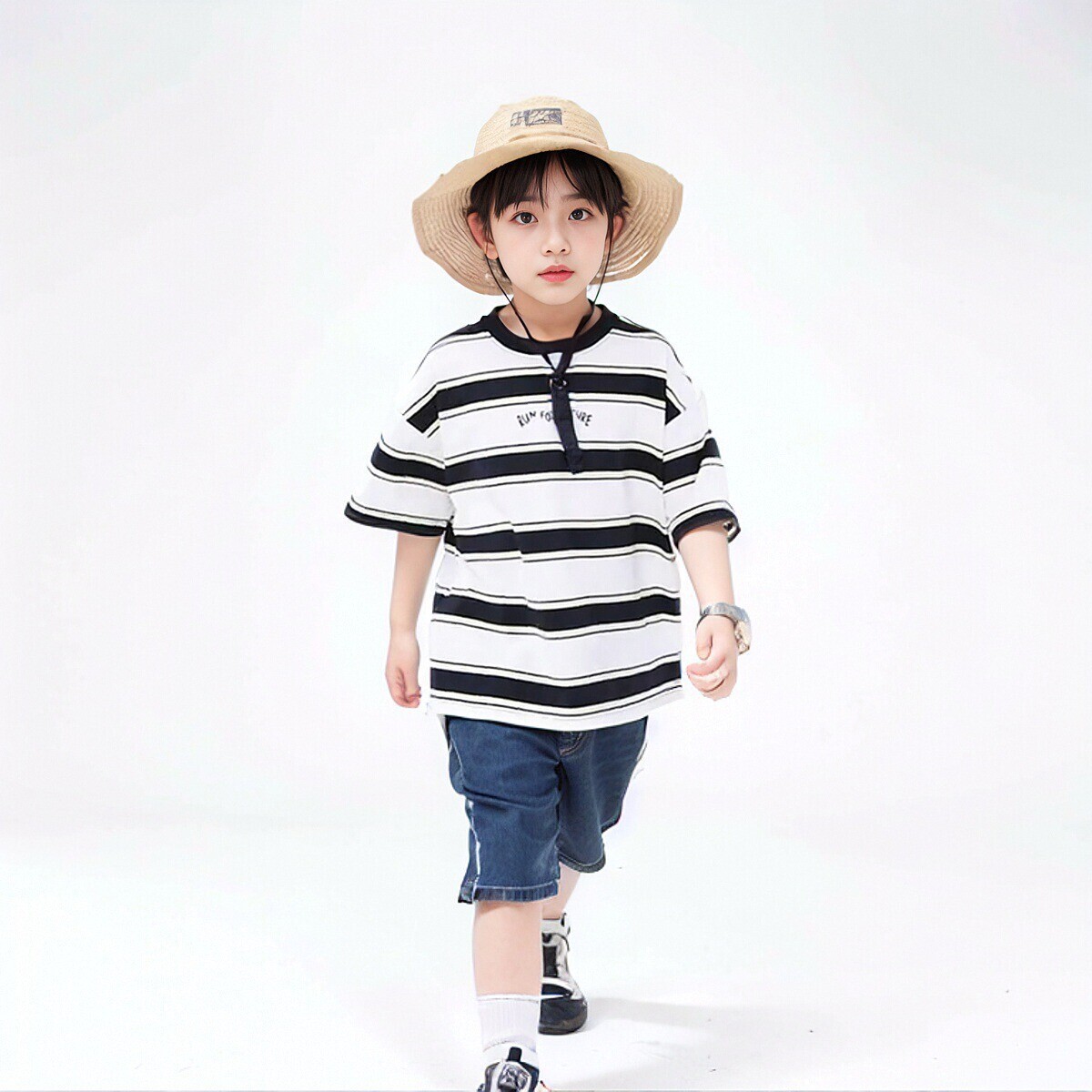 A boy with a striped T-shirt for a kid in a new summer dress in 2024.