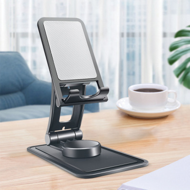 A new 360-degree rotating cell phone rack folds at multiple angles with portable desktop slabs.