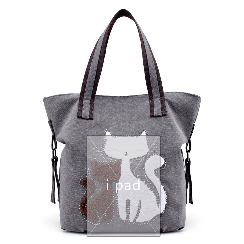 A new fashionable tweezer lady with a one-shoulder tarpaulin bag and a cute cat bag.