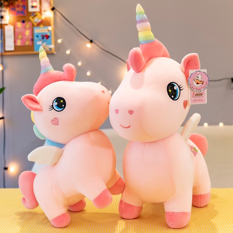 A cute unicorn birthday Christmas present for a girl with a girl with a big toy.