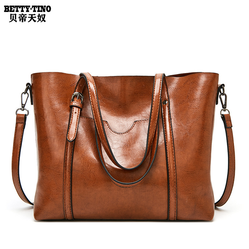 Guangzhou women's bag 2020 new European-American fashion wax skin hand-in-hand, one-shoulder-side cross-blank, large-scale wholesale delivery.