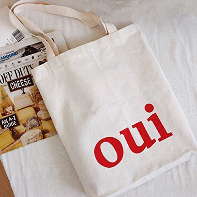 Korean-language oui-letter cotton-shopping bag, handheld cotton bags, cash, white logo one-shoulder rags.