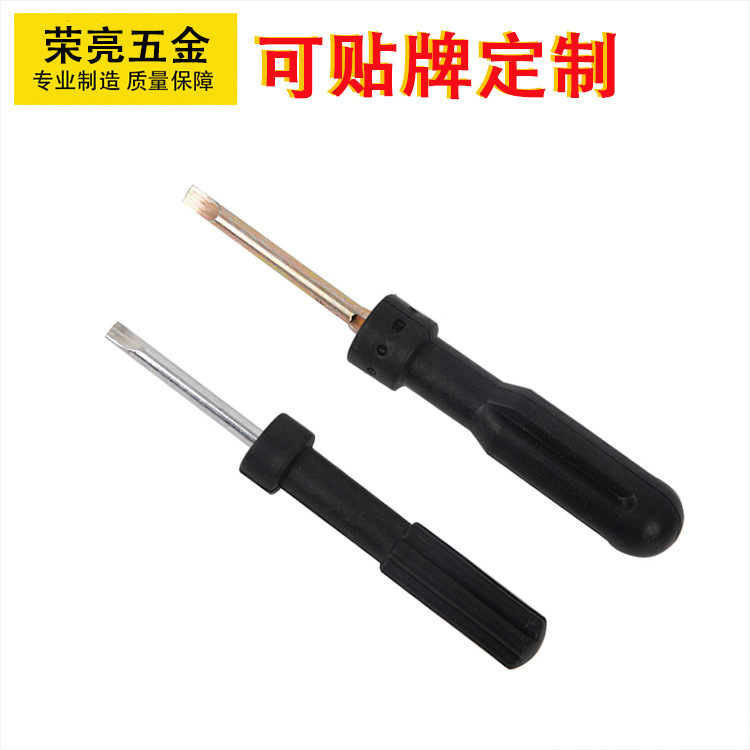 A screwdriver with a cross word of gold and a golden tool manufacturer.