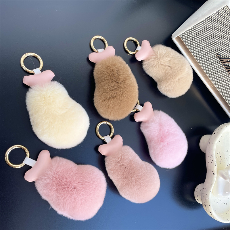 Fancy little twits, little chicken-legged car key buttons on a velvet doll bag for birthdays.