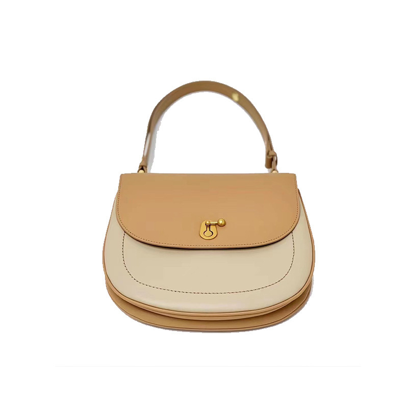 The women's bag process customised OEM 2023 new replicated leather-skin slashed tweeds, half-round saddles.