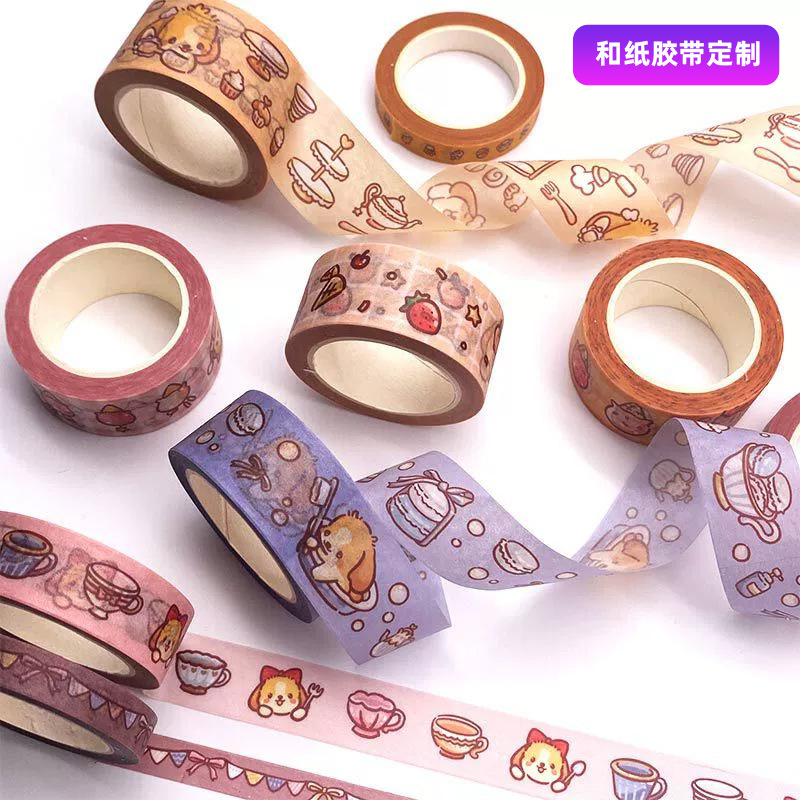 Một số ít in băng keo với một hộp băng dán giấy và một nhãn dán các vật liệu trang trí quay số.