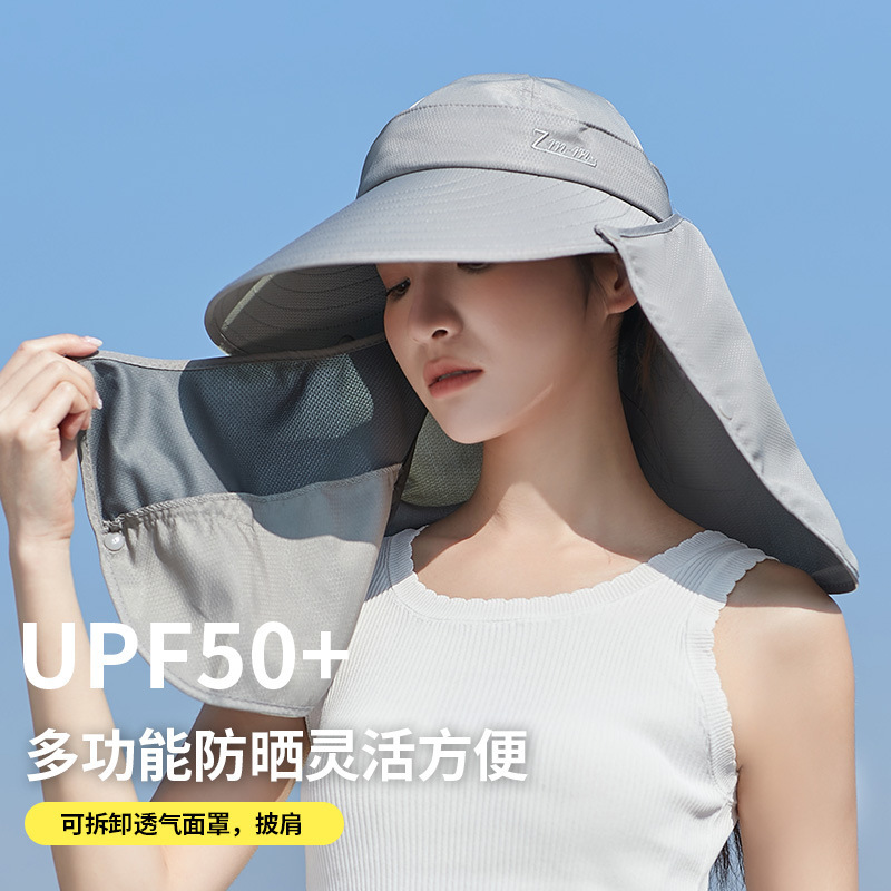 The suncap girl works outside the UV suncap to cover the sunscreen hood.