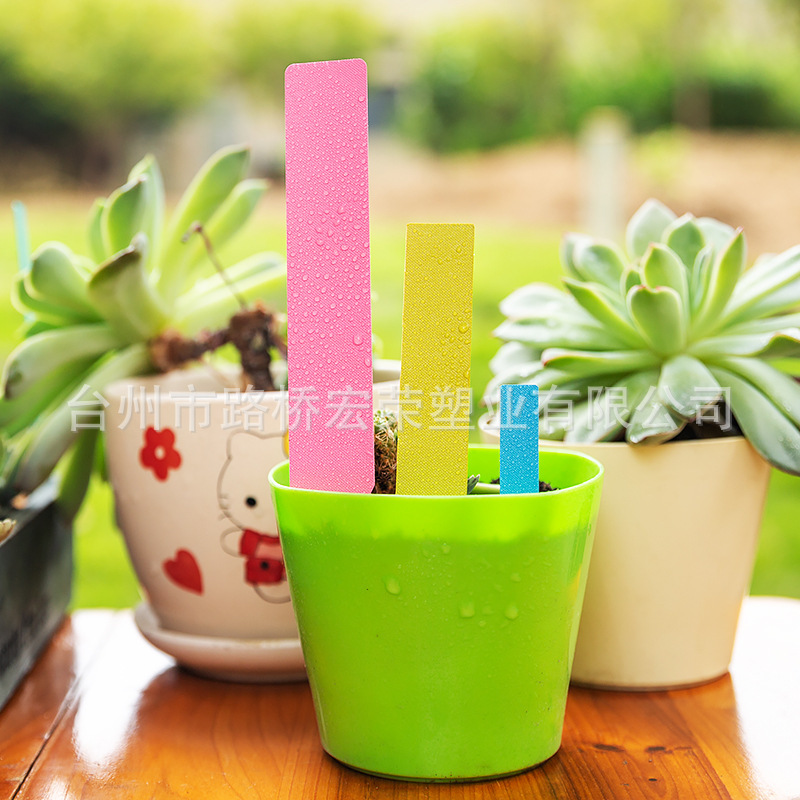 Làm vườn chống nước bằng nhựa, một nhãn hoa kiểu phông chữ, nhiều người làm ra dấu hiệu của hoa lan