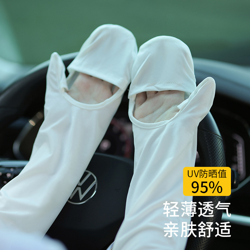 The sun-proof gloves lady rides the electric car outdoors with a long arm cuffs.