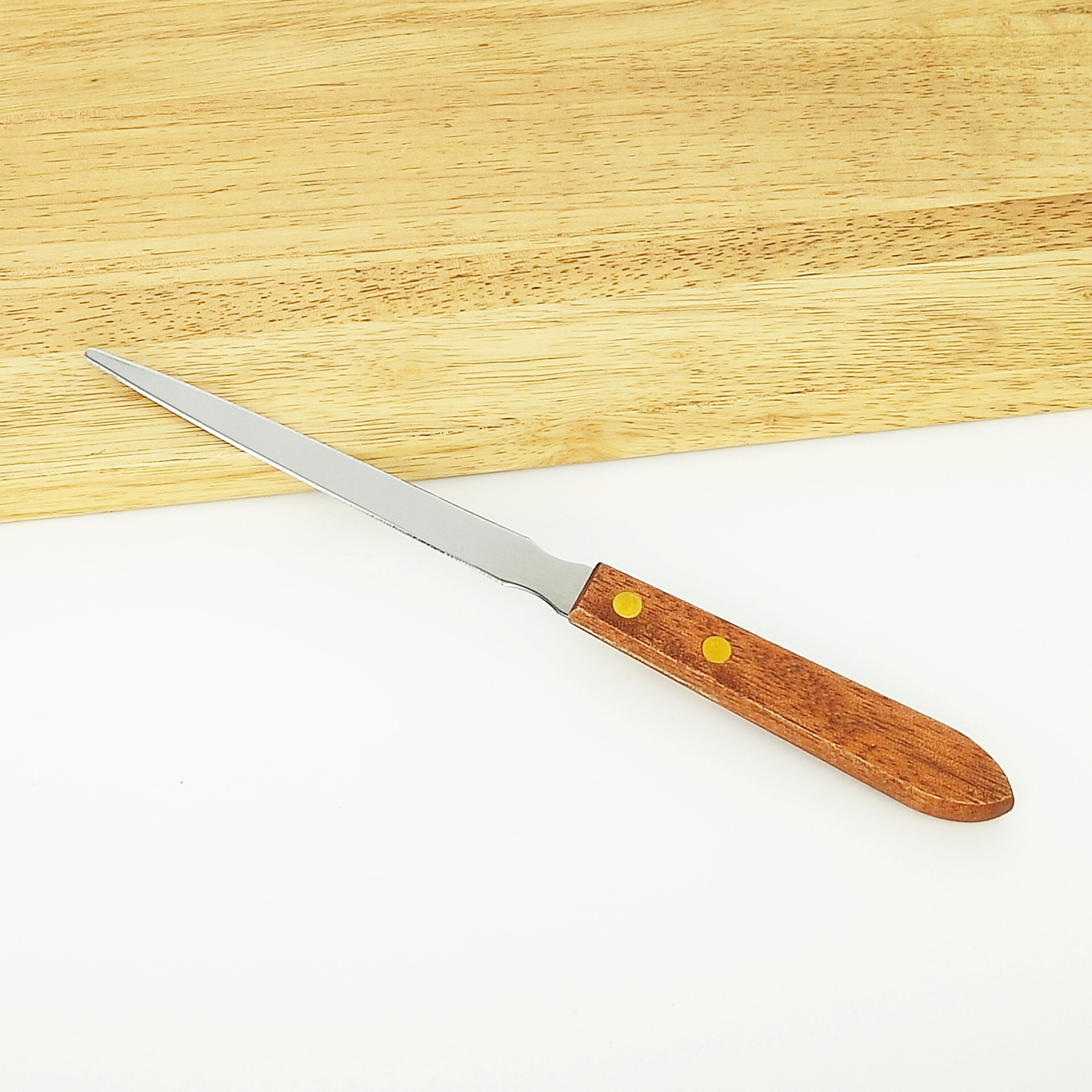 A wooden handle open letter knife, stainless steel, and a knife knife in the kitchen.