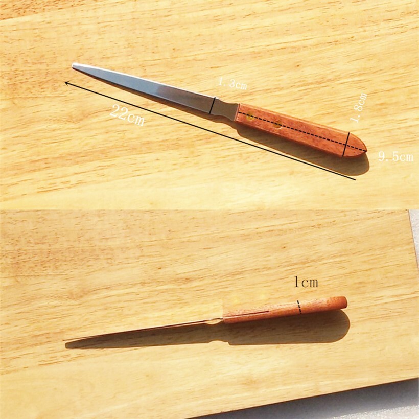 A wooden handle open letter knife, stainless steel, and a knife knife in the kitchen.