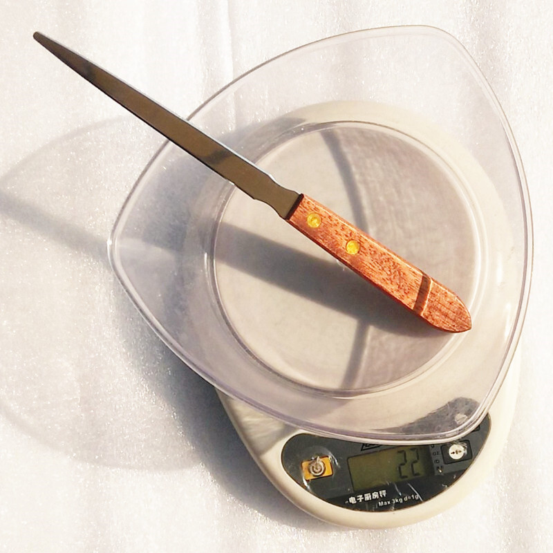 A wooden handle open letter knife, stainless steel, and a knife knife in the kitchen.