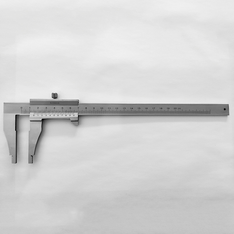 A student's track card is stainless steel, an industrial ruler, a tool to measure small scales.