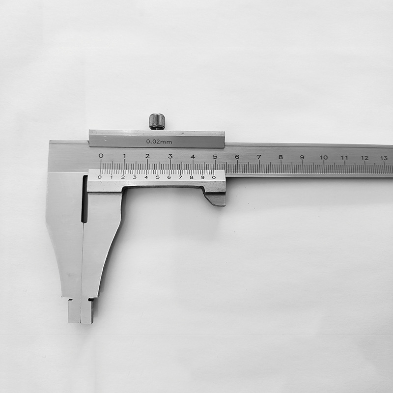 A student's track card is stainless steel, an industrial ruler, a tool to measure small scales.