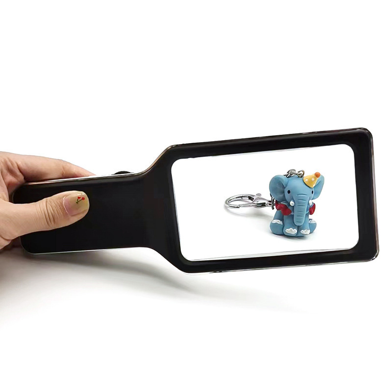 The new square is handheld with magnifying glasses and LEDs.