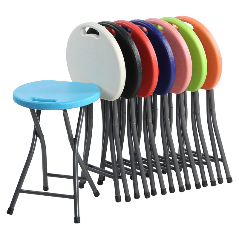 In the night market, there's a plastic folding stool, home with a thicker table and an outside stool.