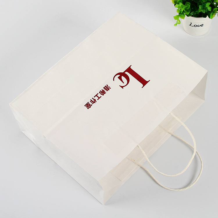 Advertising factory companies to make paper bags for hand-held white cow paper bags to customize shopping with gift bags