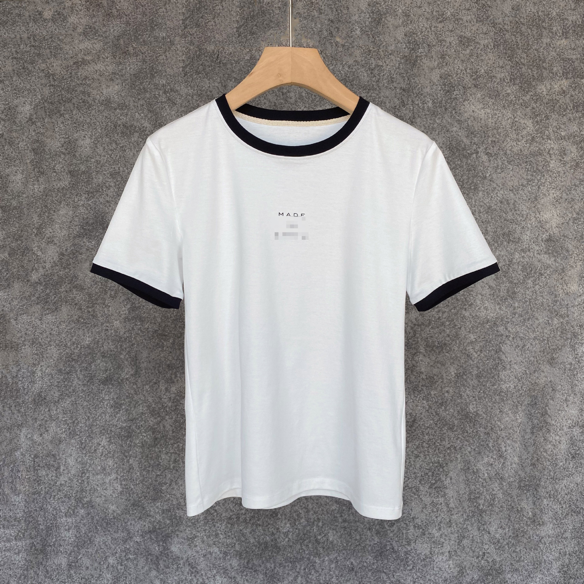 SLCC tinh khiết cotton va chạm với áo thun trắng