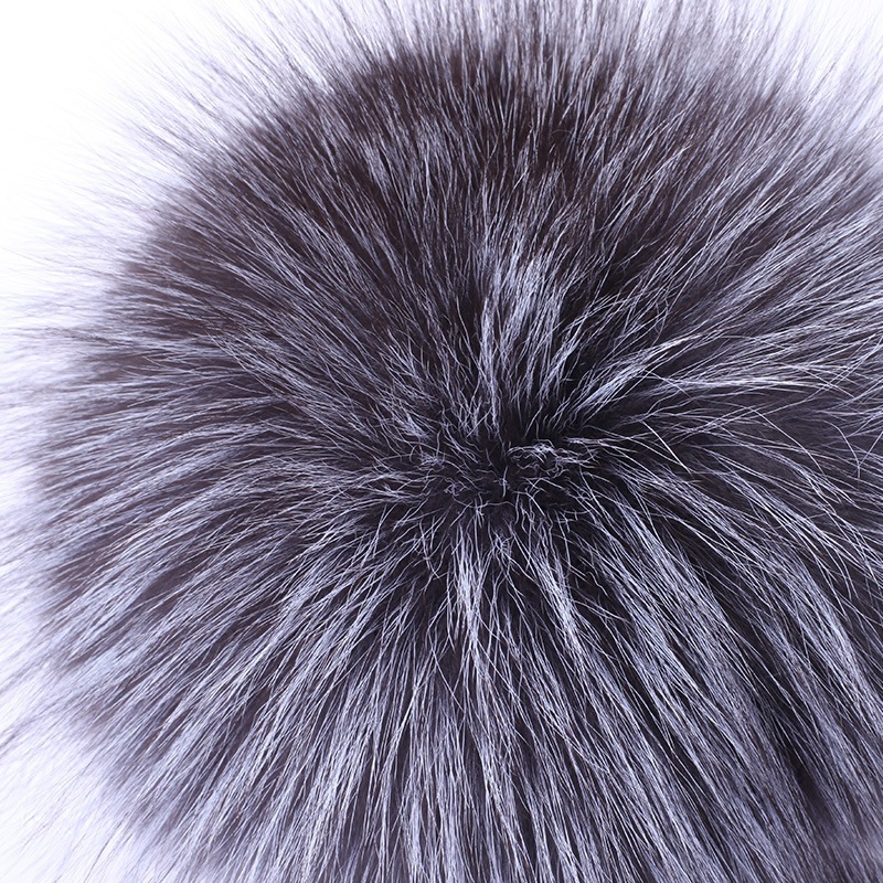 A new woman with a winter fur hat and a mink full of mink hats.