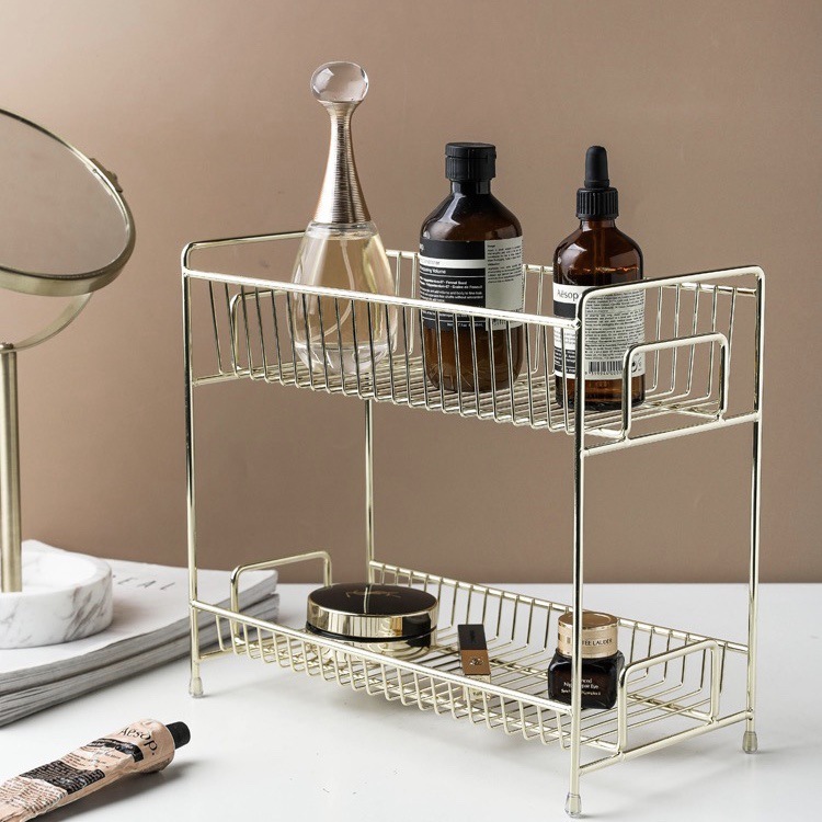 Two-story bathroom floor shelf for gold-coloured northern cosmetics.