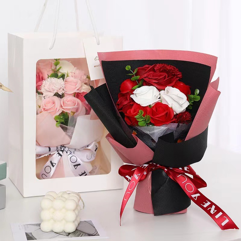 Món quà Valentine của giáo viên là một món quà Giáng sinh trắng, sự phân phối hoa hồng.