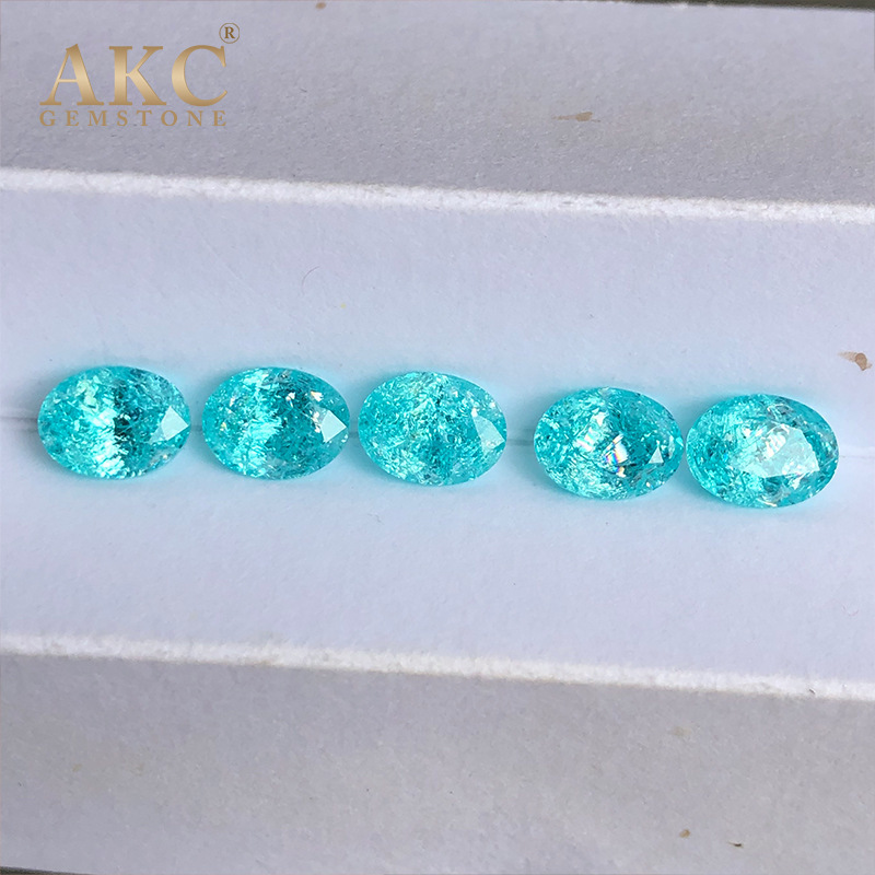 An elliptical egg shape of an AKC man-made gemstone factory imitating the natural Paraiba ice-shattering process