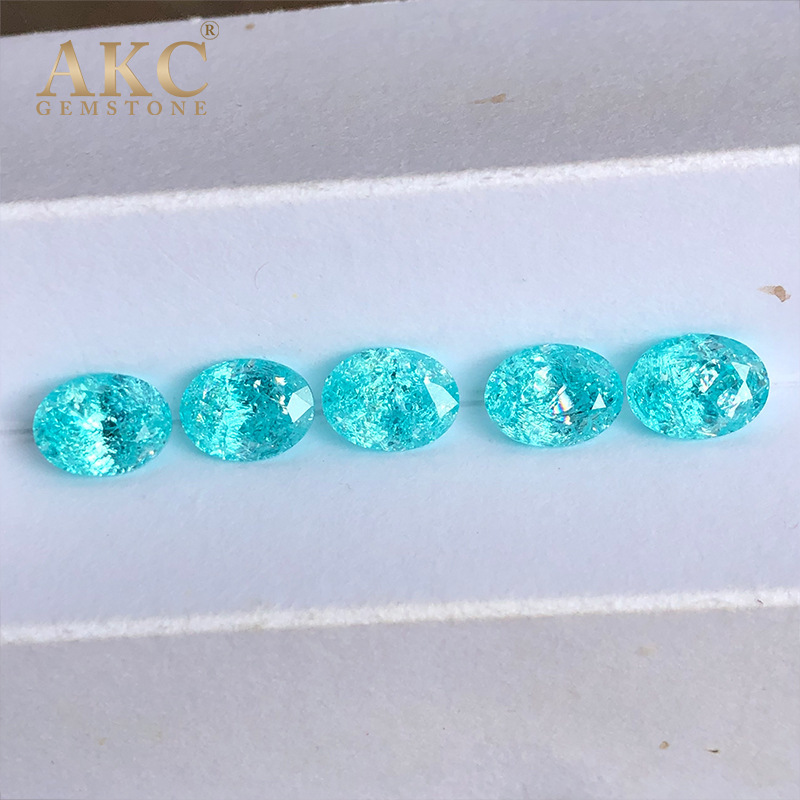 An elliptical egg shape of an AKC man-made gemstone factory imitating the natural Paraiba ice-shattering process