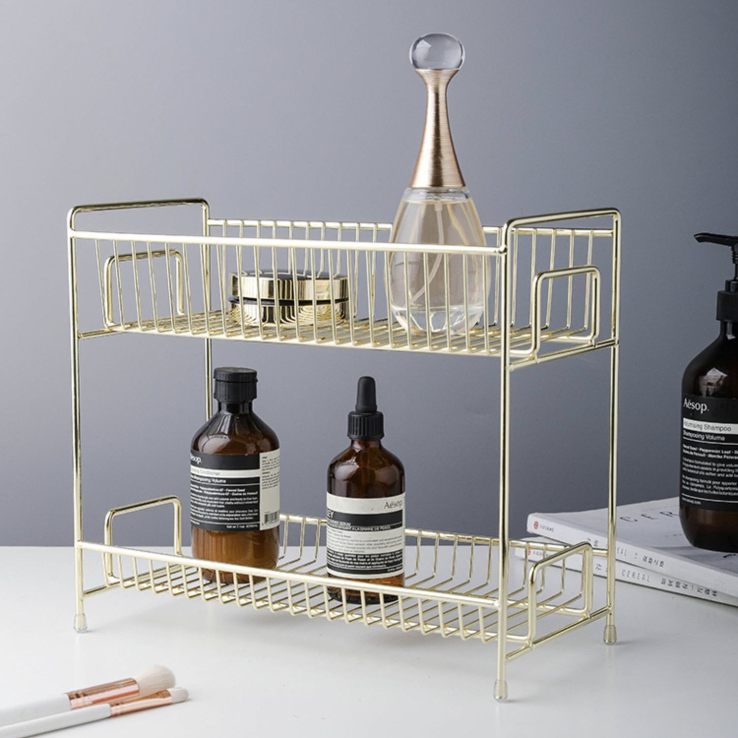 Two-story bathroom floor shelf for gold-coloured northern cosmetics.