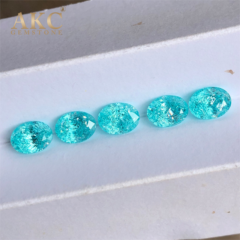 An elliptical egg shape of an AKC man-made gemstone factory imitating the natural Paraiba ice-shattering process