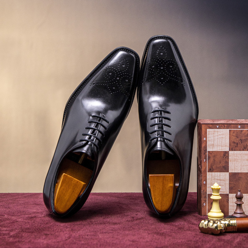 "Packing Source" man's shoe business is wearing a Braddock sculpture.