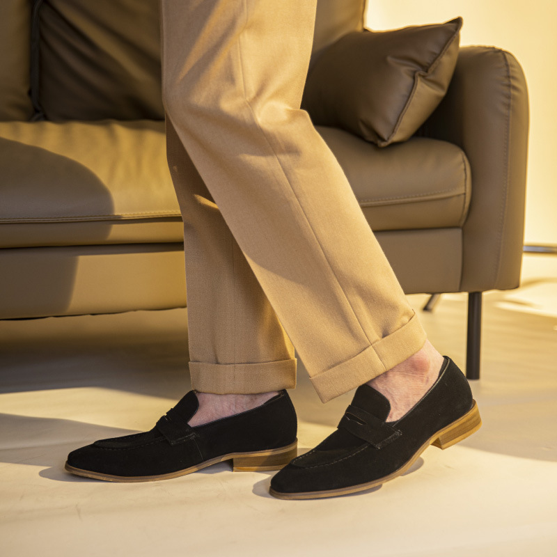 The man with the veal shoes is wearing a leprechaun-shoe.
