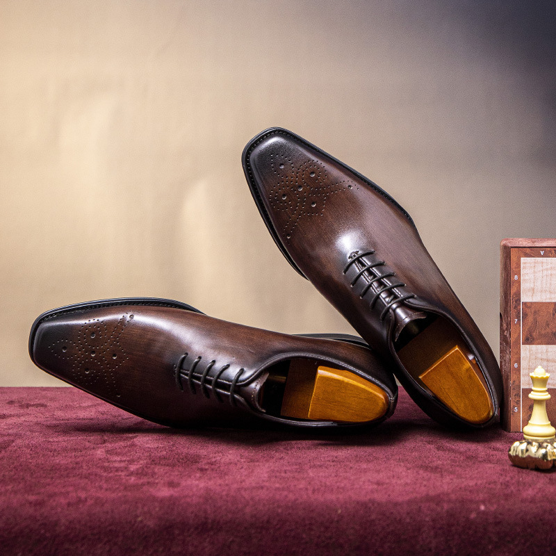 "Packing Source" man's shoe business is wearing a Braddock sculpture.