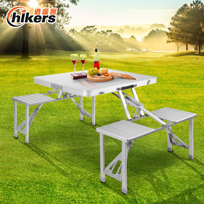 Portable outdoor folding of tables and chairs with a picnic table full of aluminum alloyed tables and chairs advertising exhibition tables