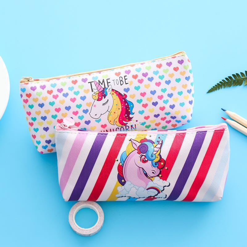 A young girl with a leather-brained unicorn pen bag for schoolgirls.